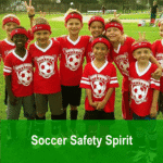 Red soccer team kids wearing protective headbands, celebrating on the field.