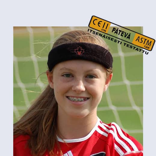 Headband with protective padding worn by a young female athlete during a soccer game.